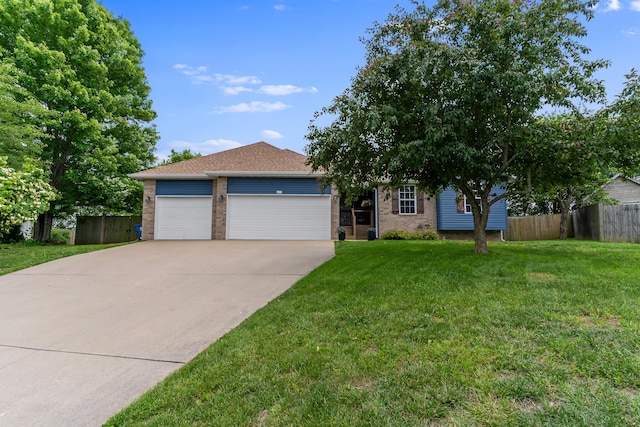 700 W Snider St, Ozark, MO 65721 - view of front facade with brick siding, driveway, and a garage