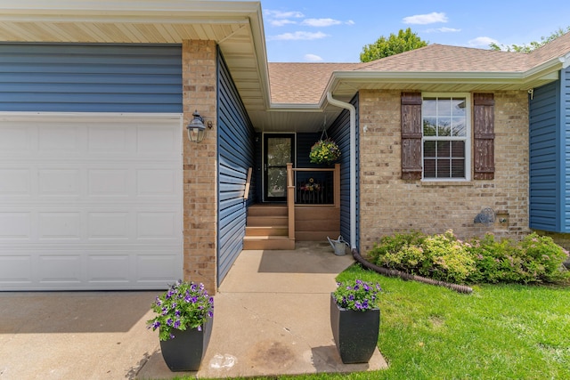 700 W Snider St, Ozark, MO 65721 - doorway to property featuring a shingled roof, brick siding, and an attached garage