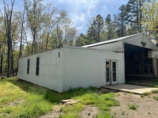 view of side of property with a patio area