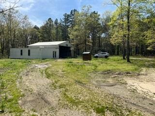 view of yard featuring an outbuilding and a pole building