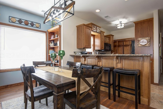 24 Village Trl Unit 5-8, Branson, MO 65616 - dining area with wood finished floors, baseboards, and recessed lighting