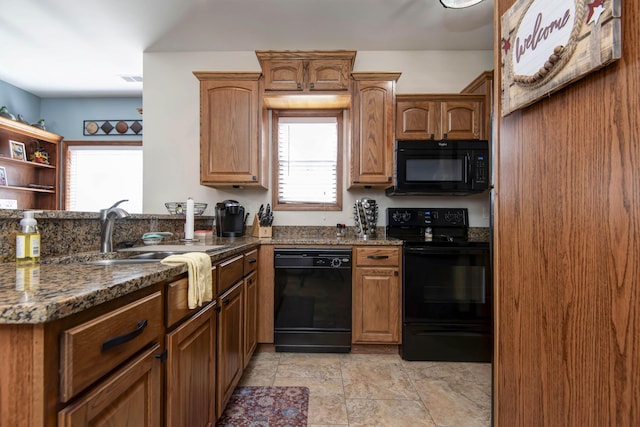24 Village Trl Unit 5-8, Branson, MO 65616 - kitchen with dark stone counters, black appliances, a sink, and plenty of natural light