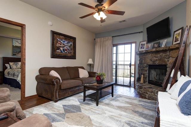 24 Village Trl Unit 5-8, Branson, MO 65616 - living room featuring visible vents, light wood-style floors, baseboards, a fireplace, and ceiling fan