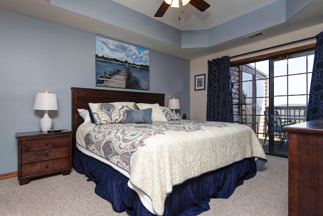 24 Village Trl Unit 5-8, Branson, MO 65616 - carpeted bedroom featuring a ceiling fan, a raised ceiling, baseboards, access to exterior, and visible vents