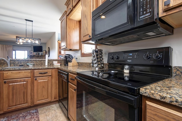 24 Village Trl Unit 5-8, Branson, MO 65616 - kitchen with black appliances, brown cabinets, dark stone countertops, and a sink