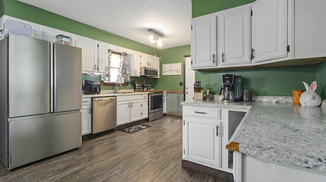 402 Lake, Mountain Grove, MO 65711 - kitchen featuring light countertops, white cabinetry, a sink, appliances with stainless steel finishes, and dark wood-style flooring