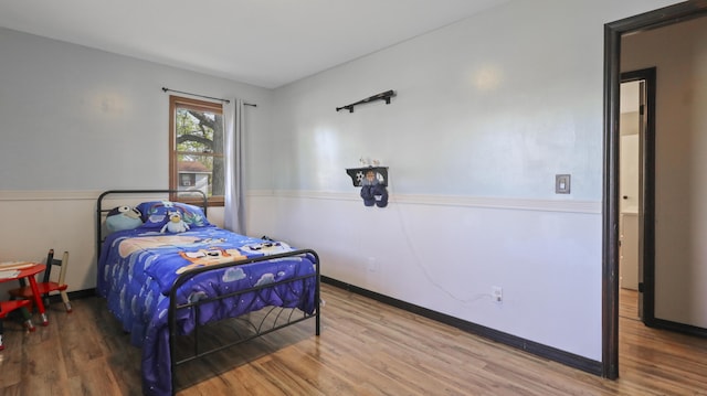 402 Lake, Mountain Grove, MO 65711 - bedroom featuring baseboards and wood finished floors
