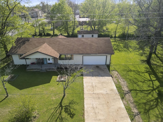 402 Lake, Mountain Grove, MO 65711 - view of front of home with an attached garage, a shingled roof, a front yard, and concrete driveway