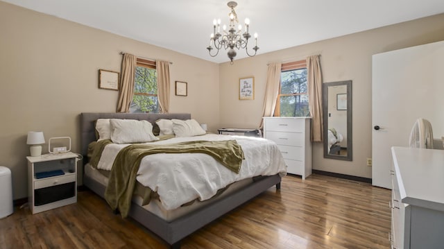 402 Lake, Mountain Grove, MO 65711 - bedroom featuring baseboards, dark wood-style flooring, an inviting chandelier, and multiple windows
