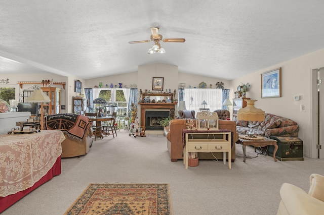 living room featuring carpet floors, a textured ceiling, vaulted ceiling, and plenty of natural light