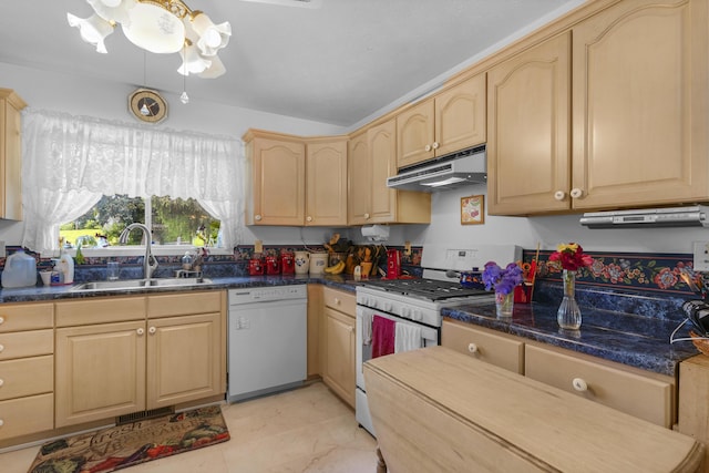 kitchen featuring visible vents, light brown cabinets, white appliances, under cabinet range hood, and a sink
