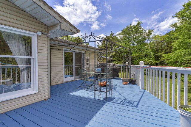 wooden deck with outdoor dining space