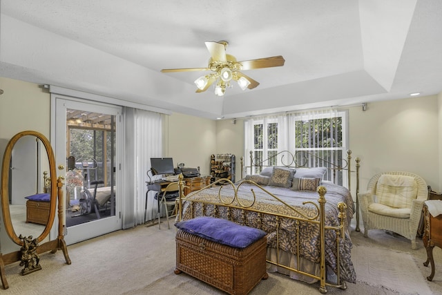 335 State Highway 265, Hollister, MO 65672 - carpeted bedroom featuring access to exterior, a raised ceiling, an office area, and ceiling fan