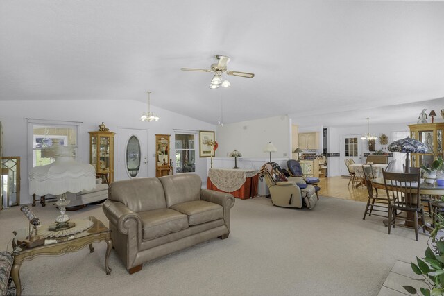 335 State Highway 265, Hollister, MO 65672 - living area with a chandelier, lofted ceiling, ceiling fan, and light colored carpet