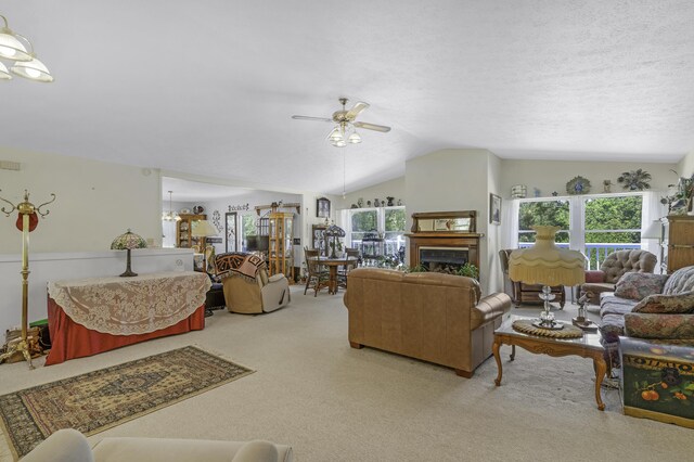 335 State Highway 265, Hollister, MO 65672 - living room featuring light colored carpet, lofted ceiling, ceiling fan, and healthy amount of natural light