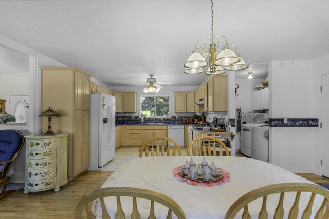 335 State Highway 265, Hollister, MO 65672 - dining room with ceiling fan, light wood finished floors, washer / dryer, and a chandelier