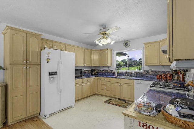 335 State Highway 265, Hollister, MO 65672 - kitchen featuring white appliances, a sink, light brown cabinets, ceiling fan, and dark countertops