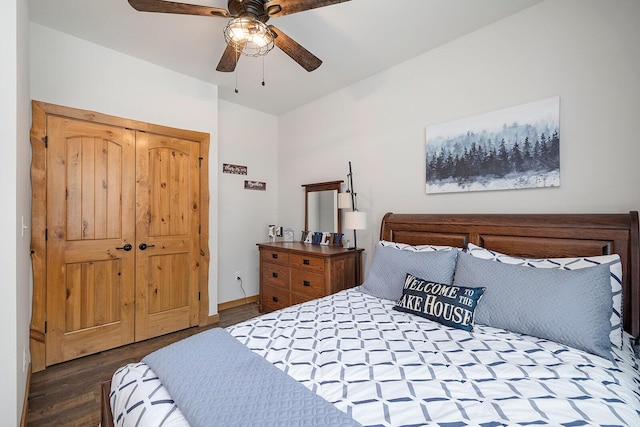 bedroom with wood finished floors, a closet, baseboards, and ceiling fan