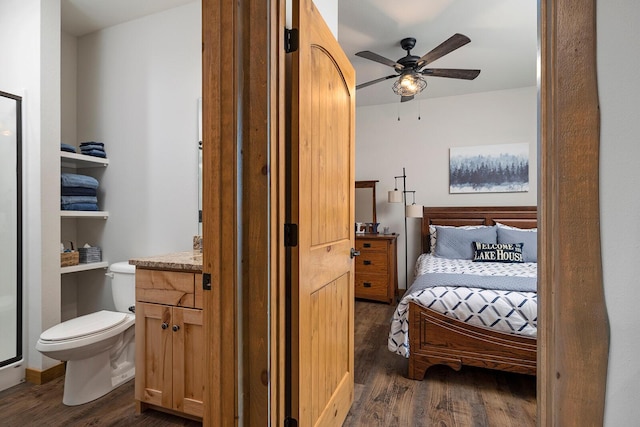 bedroom featuring a ceiling fan and dark wood-style flooring