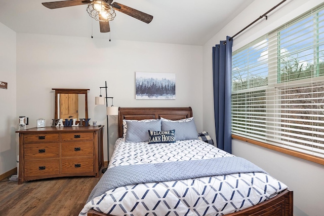 bedroom featuring a ceiling fan and wood finished floors