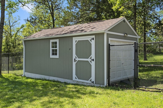 view of shed featuring fence