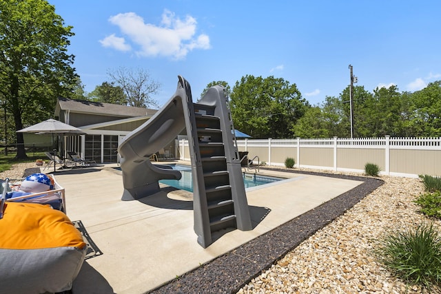 view of pool featuring a patio area, a fenced in pool, and a fenced backyard