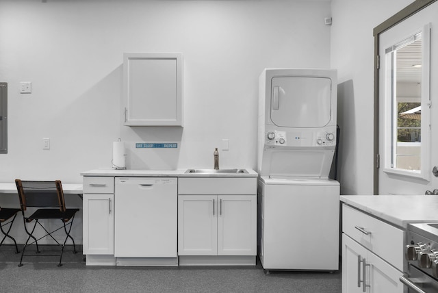 washroom with stacked washer and dryer, electric panel, laundry area, and a sink