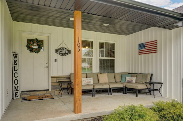 view of exterior entry with outdoor lounge area and a porch