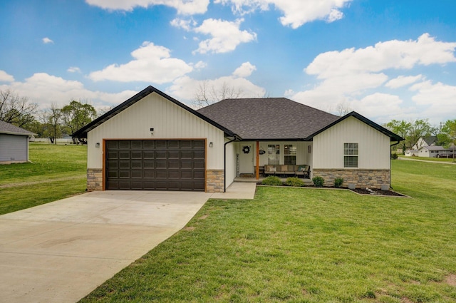 view of front of property featuring driveway, a porch, stone siding, an attached garage, and a front yard