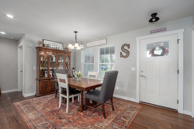 dining room with recessed lighting, an inviting chandelier, wood finished floors, and baseboards