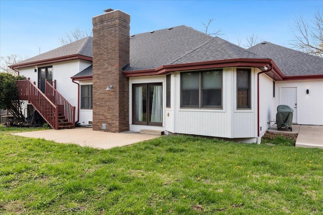 2236 E Marlan Ct, Springfield, MO 65802 - back of house with a yard, roof with shingles, a chimney, and a patio