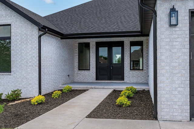 3800 W Broadmoor St, Springfield, MO 65807 - entrance to property featuring french doors, roof with shingles, and brick siding