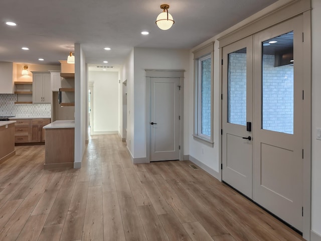 3800 W Broadmoor St, Springfield, MO 65807 - kitchen featuring open shelves, backsplash, light wood-style flooring, light countertops, and recessed lighting