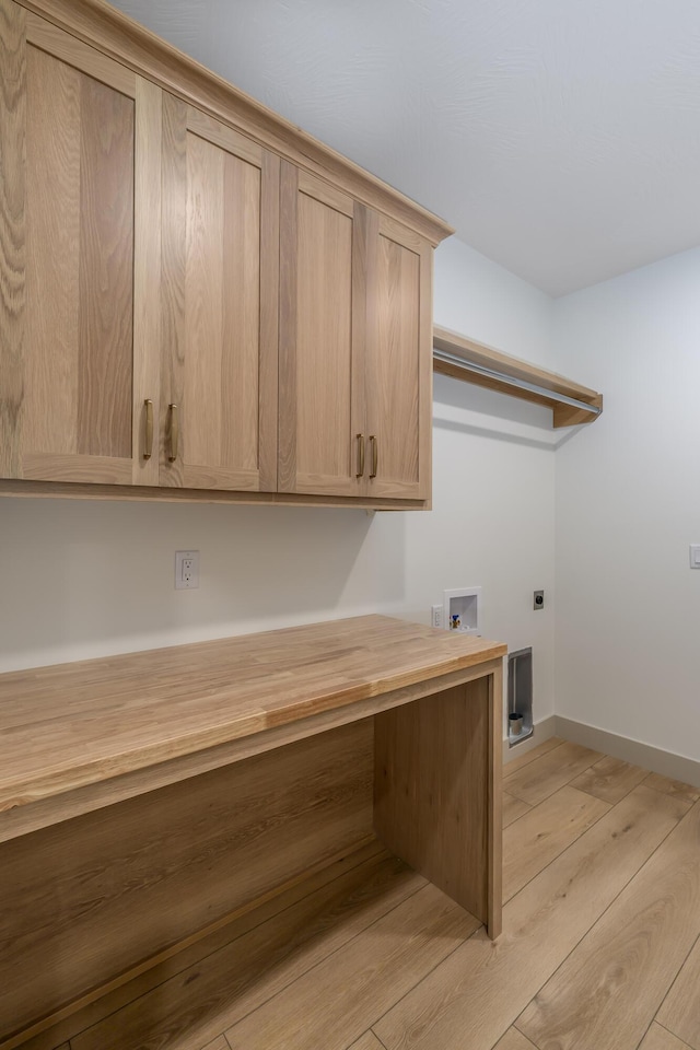 3800 W Broadmoor St, Springfield, MO 65807 - laundry room featuring cabinet space, hookup for an electric dryer, light wood-type flooring, hookup for a washing machine, and a desk