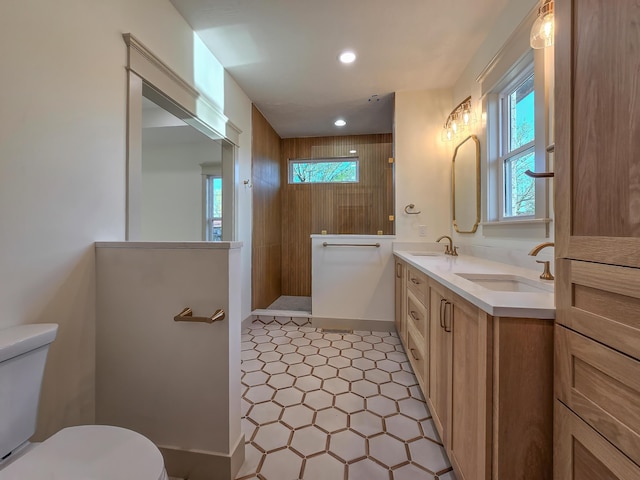 3800 W Broadmoor St, Springfield, MO 65807 - bathroom featuring healthy amount of natural light, double vanity, a walk in shower, recessed lighting, and tile patterned floors