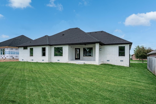 3800 W Broadmoor St, Springfield, MO 65807 - rear view of property featuring a shingled roof, a lawn, crawl space, and brick siding