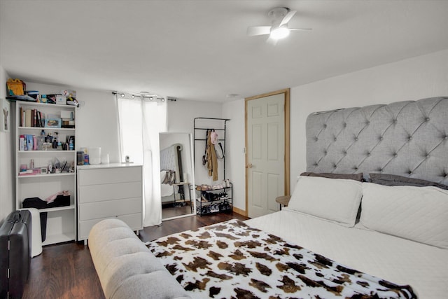 bedroom with dark wood-style flooring and ceiling fan