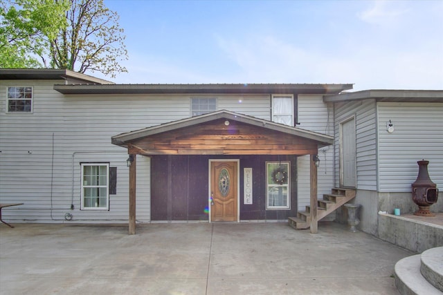 view of front facade featuring a patio and entry steps