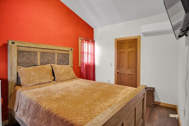 bedroom with dark wood-type flooring, a wall mounted air conditioner, vaulted ceiling, and baseboards
