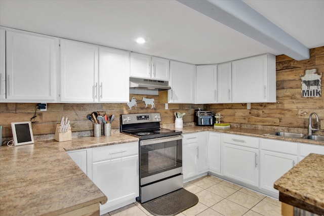 kitchen featuring light tile patterned floors, white cabinetry, a sink, stainless steel range with electric stovetop, and under cabinet range hood