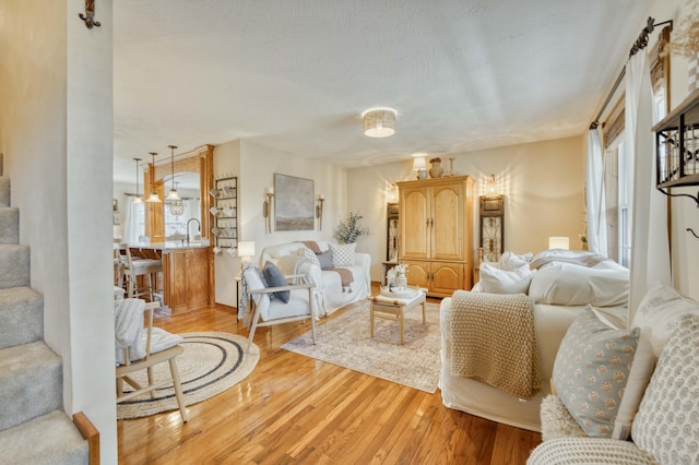 50 Tall Tree Dr, Strafford, MO 65757 - living room featuring light wood-style floors and stairs