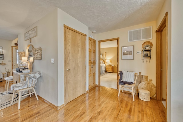 50 Tall Tree Dr, Strafford, MO 65757 - corridor with baseboards, light wood-style floors, and visible vents