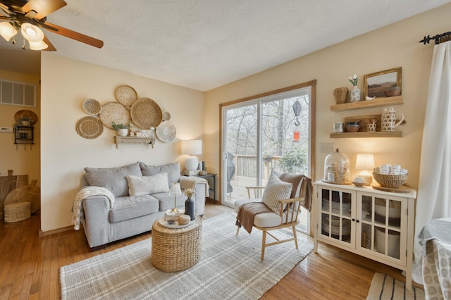 50 Tall Tree Dr, Strafford, MO 65757 - sitting room with hardwood / wood-style floors, visible vents, baseboards, and ceiling fan