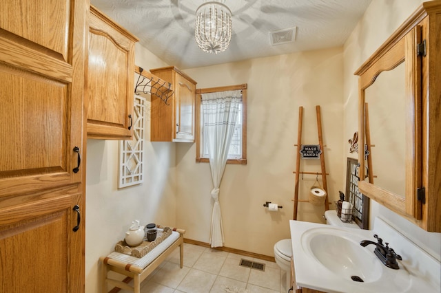 50 Tall Tree Dr, Strafford, MO 65757 - bathroom featuring a chandelier, visible vents, toilet, and tile patterned floors