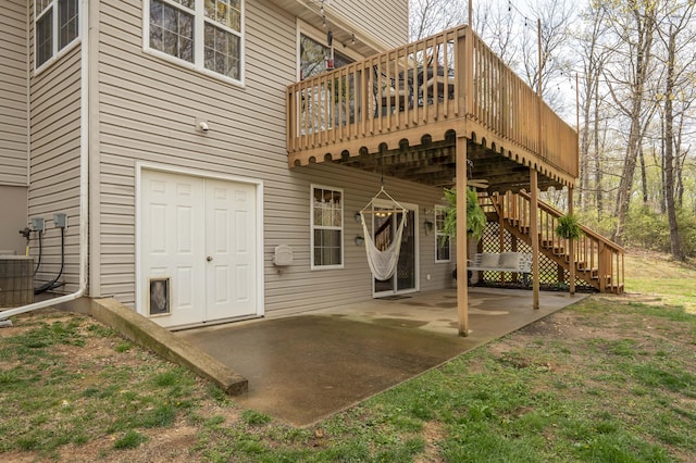 50 Tall Tree Dr, Strafford, MO 65757 - rear view of property featuring stairway, a deck, and a patio