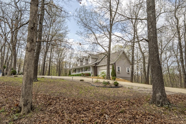 50 Tall Tree Dr, Strafford, MO 65757 - view of property exterior with a garage and curved driveway
