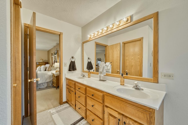 50 Tall Tree Dr, Strafford, MO 65757 - full bathroom featuring tile patterned floors, a sink, double vanity, and ensuite bathroom