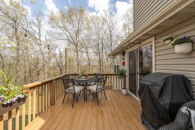 50 Tall Tree Dr, Strafford, MO 65757 - wooden terrace with outdoor dining space and area for grilling