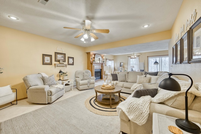 50 Tall Tree Dr, Strafford, MO 65757 - carpeted living area with visible vents, a glass covered fireplace, recessed lighting, and ceiling fan