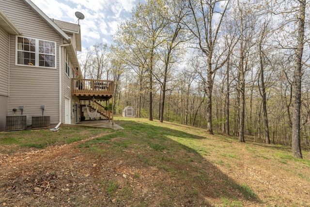 50 Tall Tree Dr, Strafford, MO 65757 - view of yard with a storage shed, a wooden deck, stairway, and an outdoor structure
